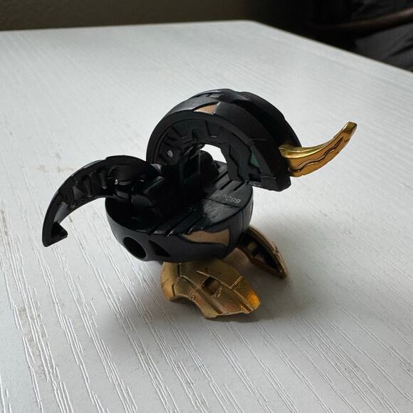 Bakugan Dragonoid 660G BakuBronze Gold Black Pyrus Battle Brawlers Spin Master - Picture 1 of 3